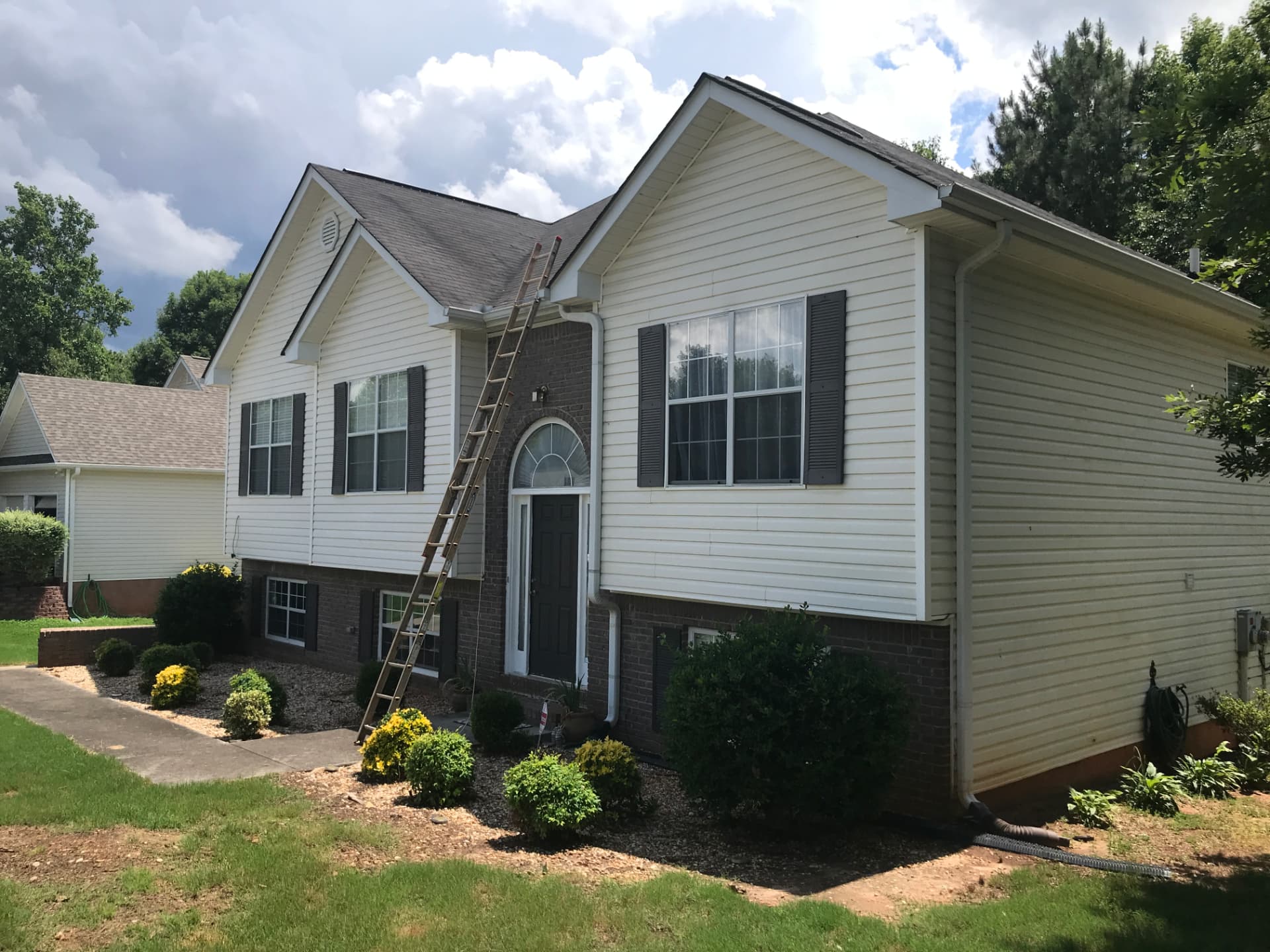 Vest Construction ladder set on a North Georgia home during a free roof inspection