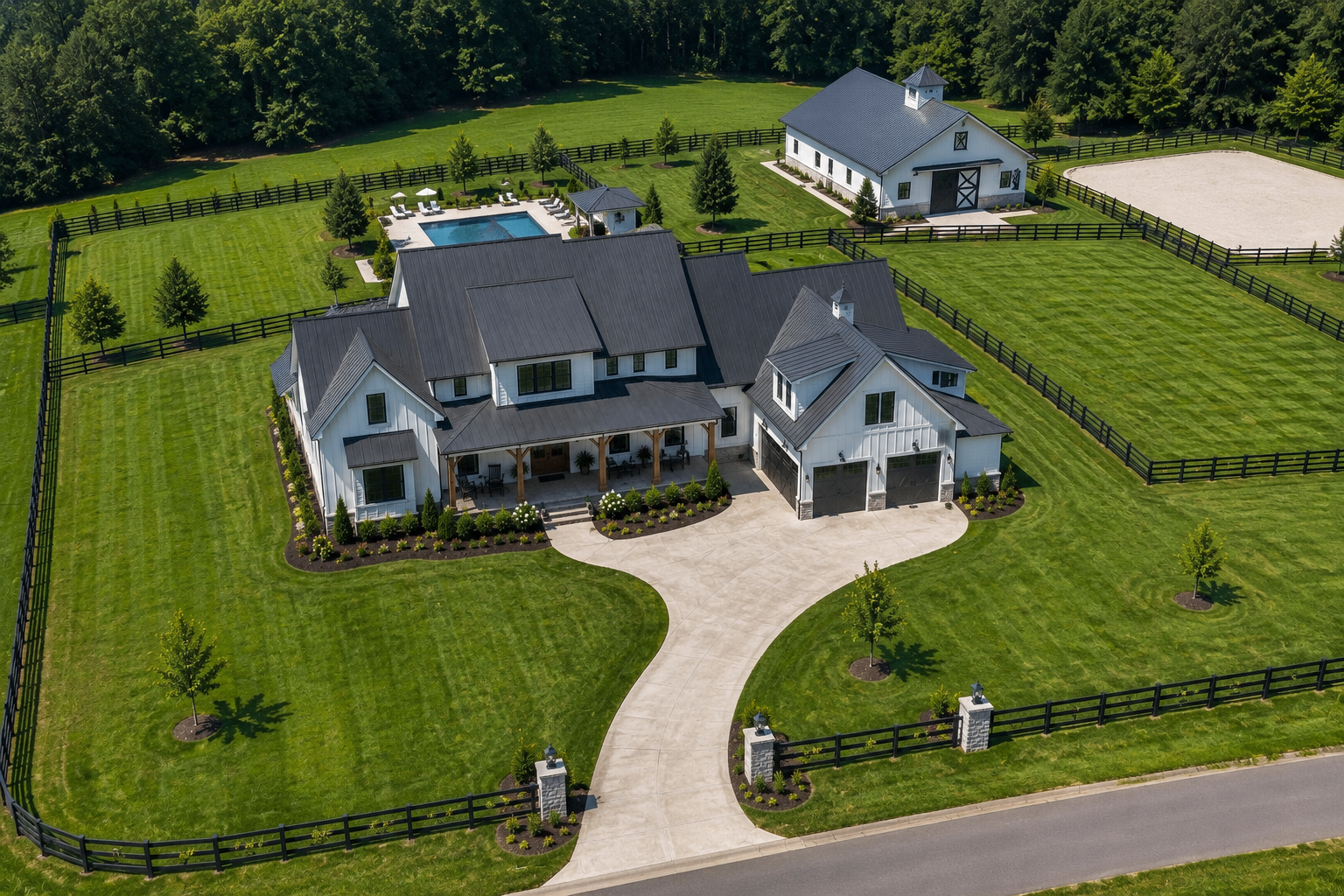 Aerial view of Westbrook Farm Residence II with barn, pool, and fenced grounds