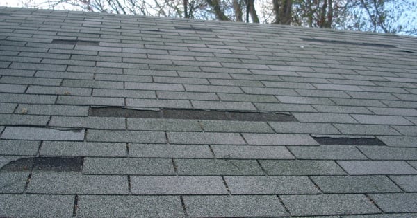 Storm damage: roof inspection photo by Vest Construction