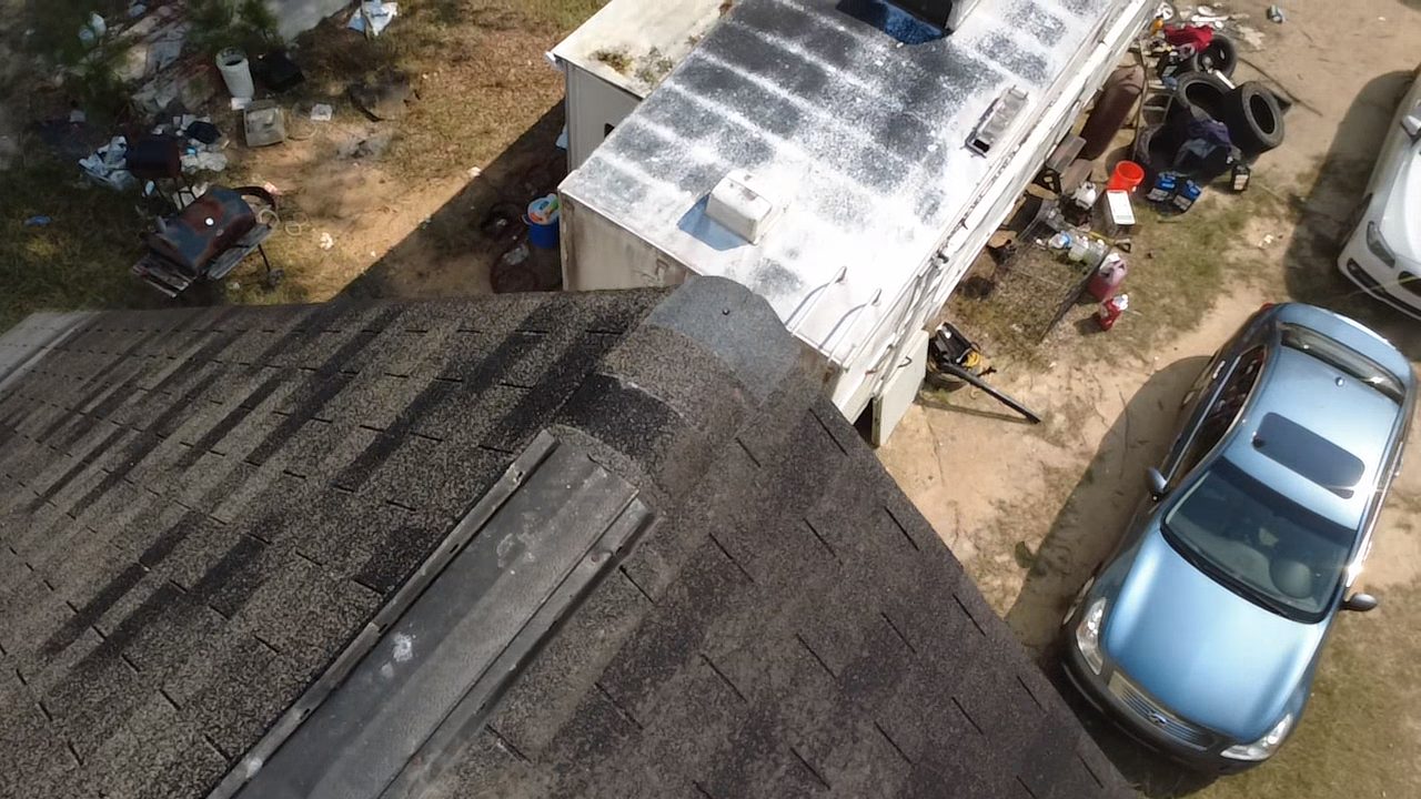Aerial inspection photo of a full roof slope and surrounding property